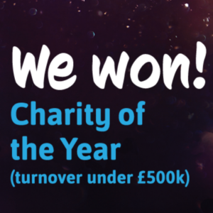 White and pale blue text on dark background reads: We won! Charity of the Year (turnover under £500k)